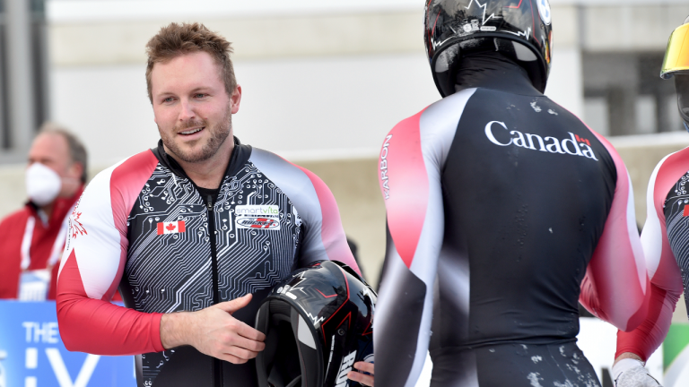 Canada's pilot Justin Kripps, left, takes third place with his team Ryan Sommer, Cam Stones and Benjamin Coakwell after the four-man bobsleigh world cuo race in Winterberg, Germany, Saturday, Dec. 11, 2021. (AP/file)