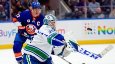 Canucks score twice early in third, rally past Islanders