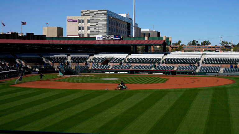 San Francisco Giants' grounds keepers prepare the baseball field at Scottsdale Stadium, Saturday, March 12, 2022, in Scottsdale, Ariz. in preparation for the upcoming first day of workouts. (AP)