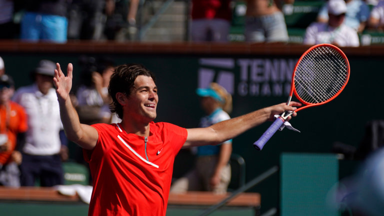 Taylor Fritz reacts after winning his men's singles semifinals match over Andrey Rublev, of Russia, at the BNP Paribas Open tennis tournament Saturday, March 19, 2022, in Indian Wells, Calif. Fritz won 7-5, 6-4. (AP)