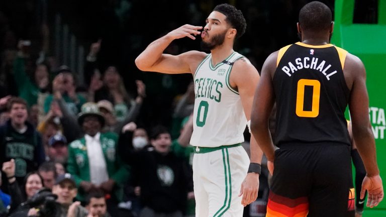 Boston Celtics forward Jayson Tatum (0) blows a kiss to fans after hitting a 3-pointer against the Utah Jazz during the first half of an NBA basketball game Wednesday, March 23, 2022, in Boston. (AP Photo/Charles Krupa)