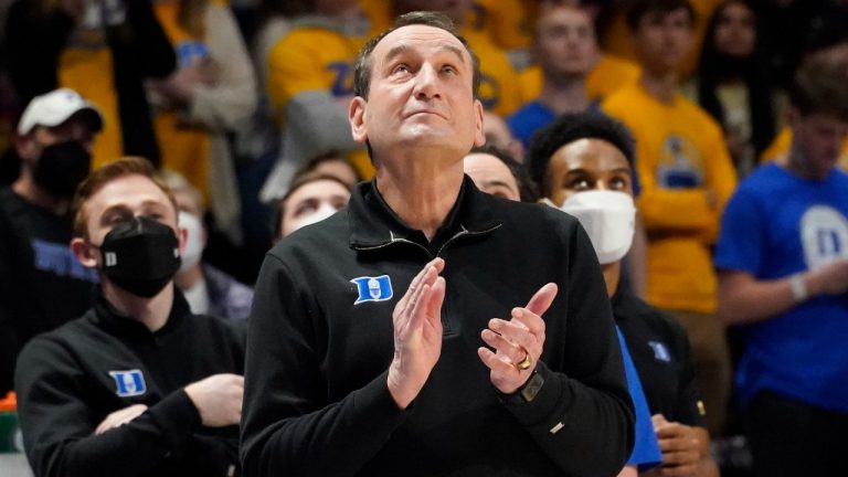 Duke coach Mike Krzyzewski applauds as he watches a video honoring him before the team's NCAA college basketball game against Pittsburgh, Tuesday, March 1, 2022, in Pittsburgh. Krzyzewski has announced his retirement at the end of the season. (Keith Srakocic/AP)