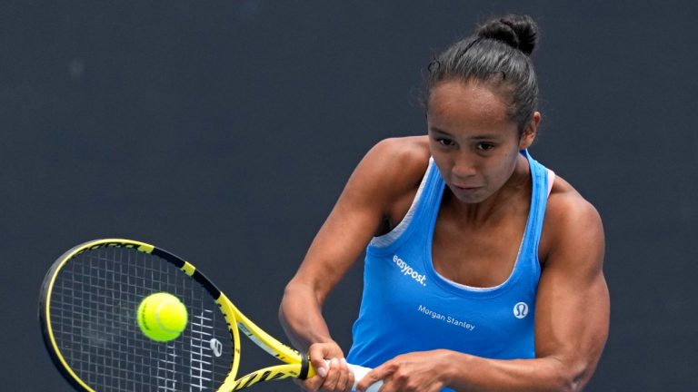 Leylah Fernandez of Canada plays a backhand return to Maddison Inglis of Australia during their first round match at the Australian Open tennis championships in Melbourne, Australia, Tuesday, Jan. 18, 2022. (Simon Baker/AP Photo)