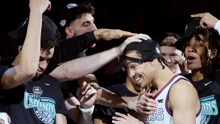 Gonzaga players celebrate after defeating Saint Mary's at the West Coast Conference Championship Tuesday, March 8, 2022, in Las Vegas. (AP Photo/John Locher)