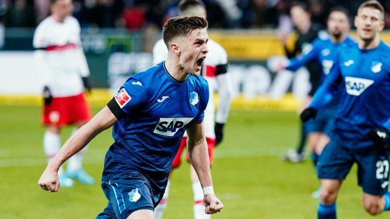 Hoffenheim's Christoph Baumgartner, centre, celebrates scoring during the Bundesliga soccer match between TSG 1899 Hoffenheim and VfB Stuttgart at the PreZero Arena, Sinsheim, Germany, Friday Feb. 25, 2022. (Uwe Anspach/dpa via AP)