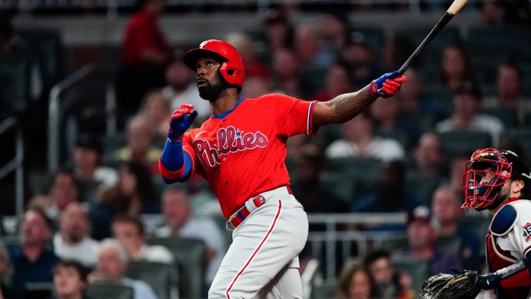 Philadelphia Phillies' Andrew McCutchen (22) hits a two-run homer in the seventh inning of a baseball game against the Atlanta Braves, Thursday, Sept. 30, 2021, in Atlanta. (John Bazemore/AP Photo)