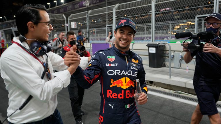 Red Bull driver Sergio Perez of Mexico reacts after winning pole position at the Formula One Grand Prix it in Jiddah, Saudi Arabia, Saturday, March 26, 2022. (Hassan Ammar/AP)