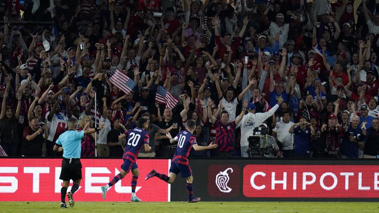 United States' Christian Pulisic (10) celebrates after scoring his third goal of the game during the second half of a FIFA World Cup qualifying soccer match against Panama. (Julio Cortez/AP)