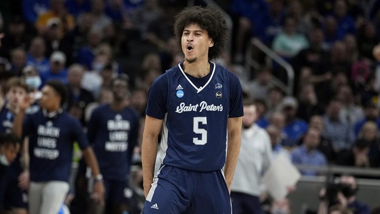 St. Peter's guard Daryl Banks III (5) celebrates after making a 3-point basket during the first half of a college basketball game against Kentucky in the first round of the NCAA tournament. (Darron Cummings/AP)