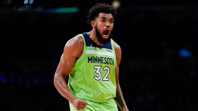 Minnesota Timberwolves' Karl-Anthony Towns celebrates his three-point basket during the second half of an NBA basketball game against the Los Angeles Lakers Friday, Nov. 12, 2021, in Los Angeles. (Jae C. Hong/AP Photo)