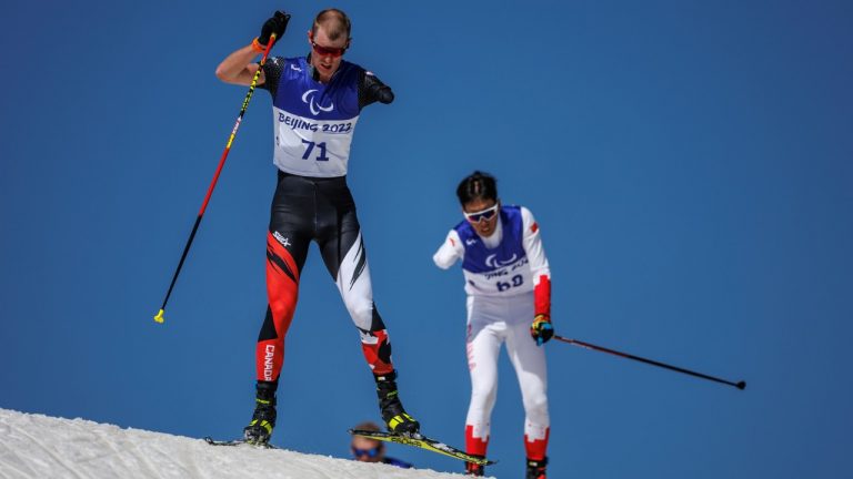 In this photo provided by the Olympic Information Services, Mark Arendz of Canada (LW6) competes in the men's Middle Distance Standing Para Biathlon at the Zhangjiakou National Biathlon Centre during the Beijing Winter Paralympic Games in Zhangjiakou, China, Tuesday, March 8, 2022. (Simon Bruty/IOC for OIS via AP)