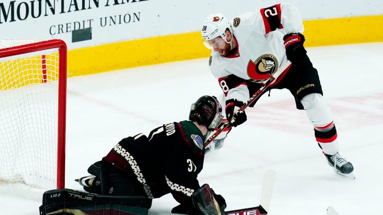 Ottawa Senators right wing Connor Brown (28) gets his shot stopped by Arizona Coyotes goaltender Scott Wedgewood, left, during the first period of an NHL hockey game Saturday, March 5, 2022, in Glendale, Ariz. (Ross D. Franklin/AP)