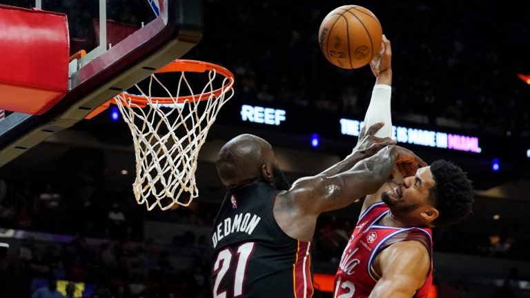 Philadelphia 76ers forward Tobias Harris (12) aims for the basket as Miami Heat center Dewayne Dedmon (21) defends during the first half of an NBA basketball game, Saturday, March 5, 2022, in Miami. (Marta Lavandier/AP)