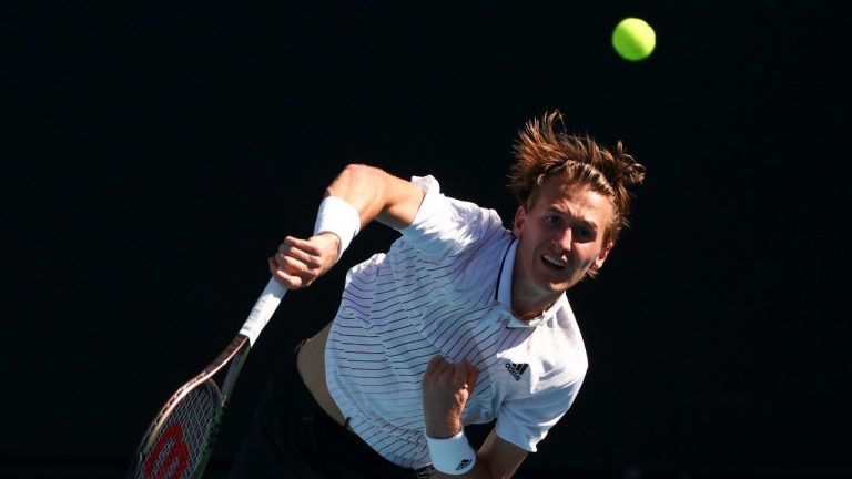 Sebastian Korda of the U.S. serves to Pablo Carreno Busta of Spain during their third round match at the Australian Open tennis championships in Melbourne, Australia, Friday, Jan. 21, 2022. (Tertius Pickard/AP)