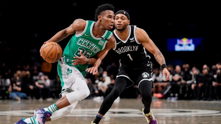 Boston Celtics forward Aaron Nesmith (26) drives past Brooklyn Nets forward Bruce Brown (1) during the second half of an NBA basketball game, Tuesday, Feb. 8, 2022, in New York. (John Minchillo/AP)