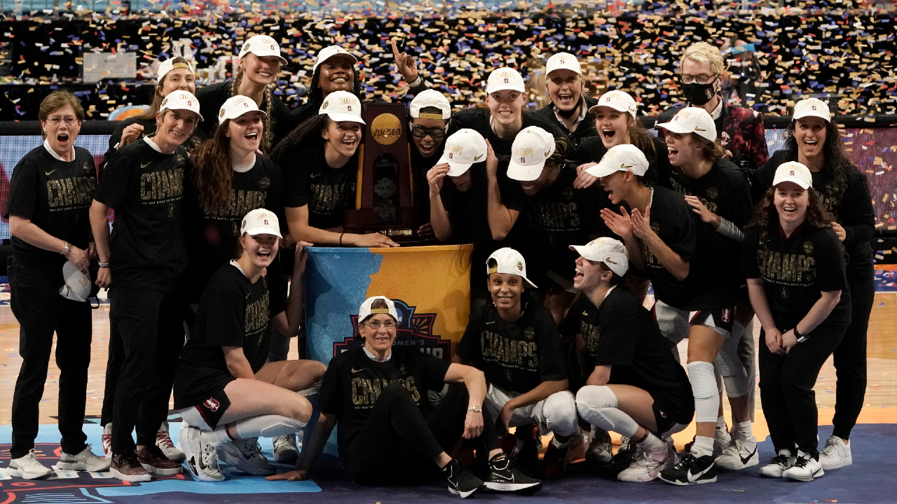 Stanford players celebrate with the trophy after the championship game against Arizona in the women's Final Four NCAA college basketball tournament, Sunday, April 4, 2021, at the Alamodome in San Antonio. Stanford won 54-53. (Morry Gash/AP) 