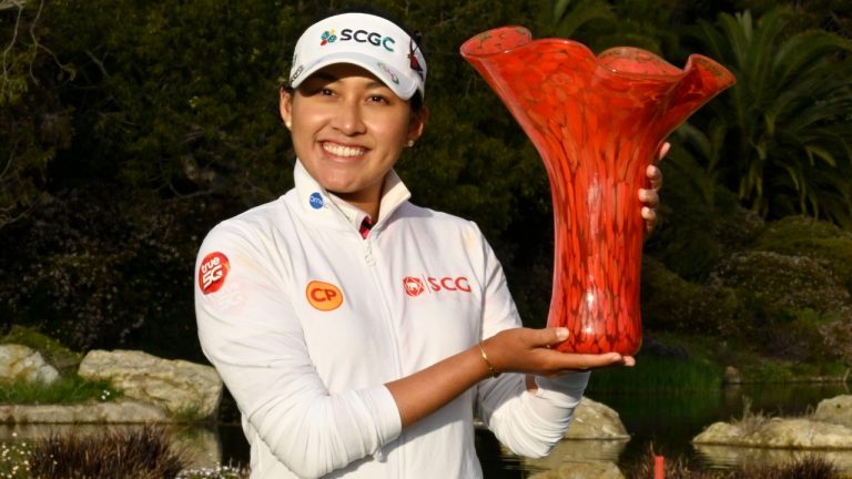 Atthaya Thitikul, of Thailand, holds up the trophy after winning the JTBC LPGA golf tournament, Sunday, March 27, 2022, in Carlsbad, Calif. (Denis Poroy/AP)