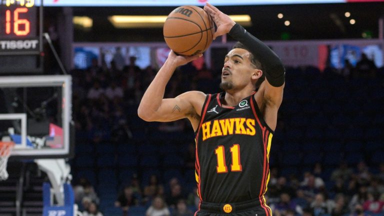Atlanta Hawks guard Trae Young shoots a 3-pointer during the first half of the team's NBA basketball game against the Orlando Magic, Wednesday, Feb. 16, 2022, in Orlando, Fla. (Phelan M. Ebenhack/AP)