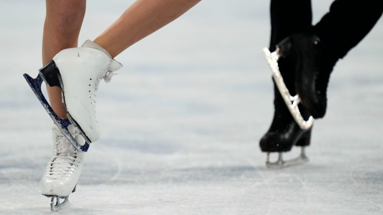 Gabriella Papadakis and Guillaume Cizeron, of France, perform their routine in the ice dance competition during the figure skating at the 2022 Winter Olympics, Monday, Feb. 14, 2022, in Beijing. (AP Photo/Bernat Armangue)