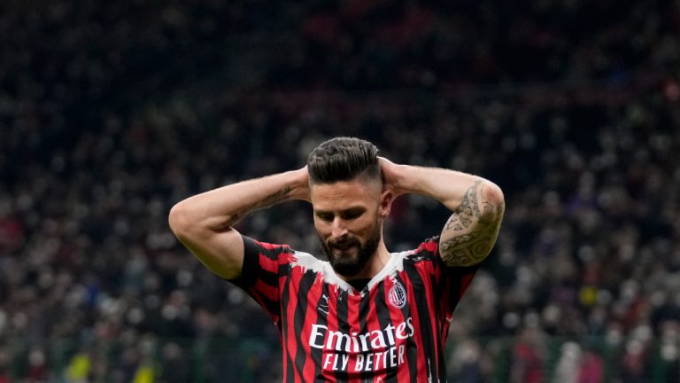 AC Milan's Olivier Giroud reacts during the Serie A soccer match between AC Milan and Bologna at the San Siro stadium, in Milan, Italy, Monday, April 4, 2022. (AP Photo/Antonio Calanni)