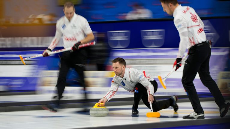 Canada Skip Brad Gushue delivers a stone against Germany during the World Men's Curling Championships, Tuesday, April 5, 2022, in Las Vegas. (AP Photo/John Locher)