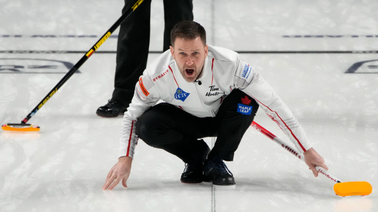 Canada skip Brad Gushue yells to the sweepers during the World Men's Curling Championships against Germany, Tuesday, April 5, 2022, in Las Vegas. (AP)