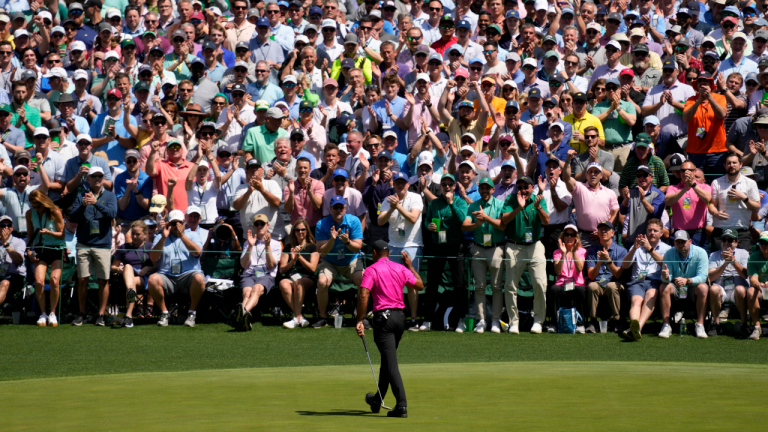 The gallery applauds Tiger Woods after his putt on the sixth hole during the first round at the Masters golf tournament on Thursday, April 7, 2022, in Augusta, Ga. (AP)