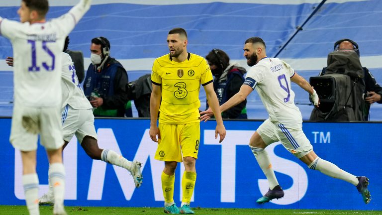 Real Madrid's Karim Benzema, right, celebrates after he scored his side's second goal during the Champions League, quarterfinal second leg soccer match between Real Madrid and Chelsea at the Santiago Bernabeu stadium in Madrid, Spain, Tuesday, April 12, 2022. (Manu Fernandez/AP)