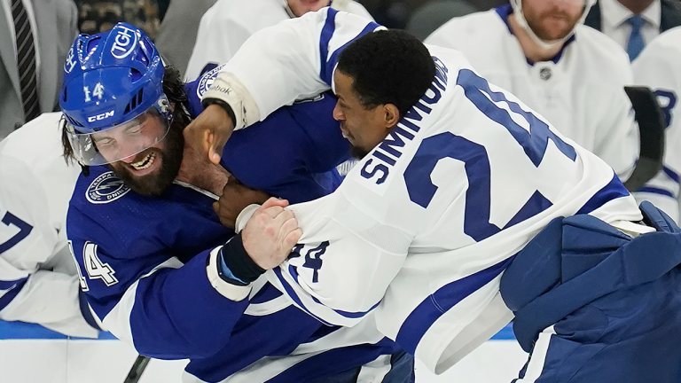 Toronto Maple Leafs right wing Wayne Simmonds (24) and Tampa Bay Lightning left wing Pat Maroon (14) fight during the second period of an NHL hockey game Thursday, April 21, 2022, in Tampa, Fla. (AP)