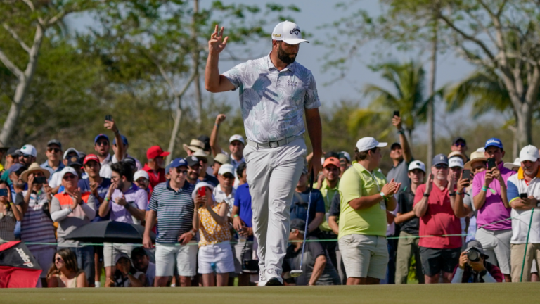 Jon Rahm, of Spain, waves to spectators on the 18th hole after finishing the third round of the Mexico Open at Vidanta in Puerto Vallarta, Mexico, Saturday, April 30, 2022. (AP)
