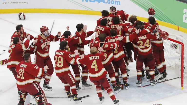 Denver players celebrate after defeating Minnesota State in the NCAA men's Frozen Four championship college hockey game. (Michael Dwyer/AP)