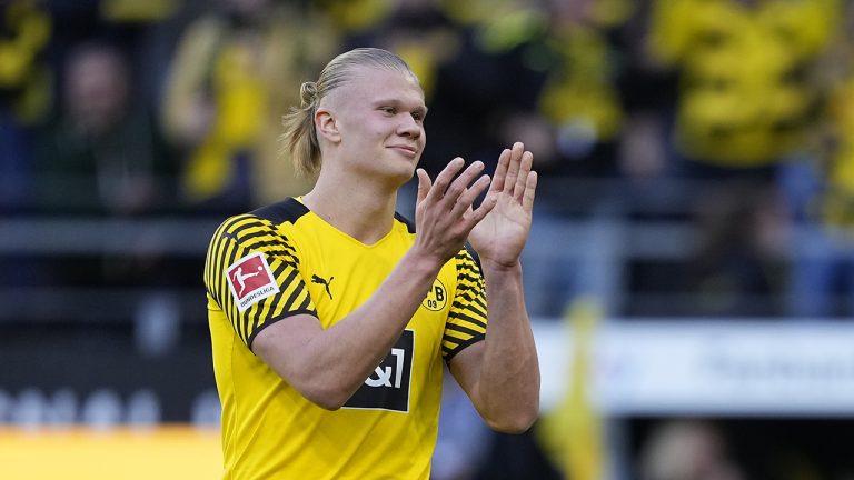 Dortmund's scorer Erling Haaland celebrates after he scored his side's 5th goal during the German Bundesliga soccer match between Borussia Dortmund and VfL Wolfsburg in Dortmund. (Martin Meissner/AP)