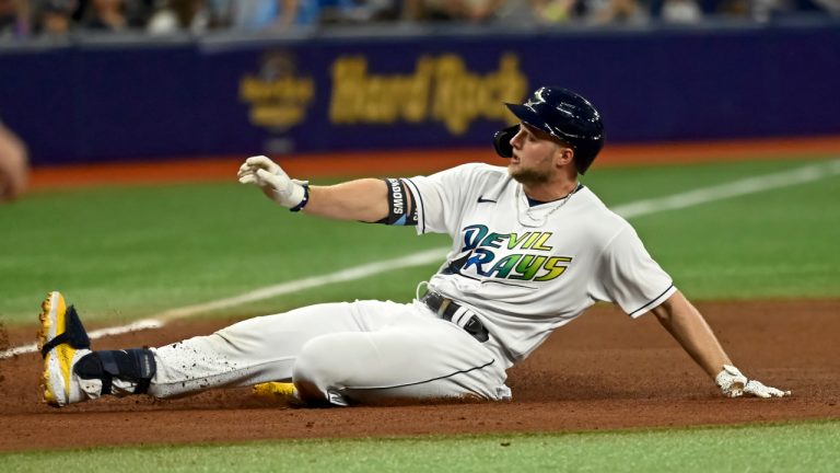 Tampa Bay Rays' Austin Meadows slides into third base with a triple off Miami Marlins' Sandy Alcantara during the fourth inning of a baseball game Saturday, Sept. 25, 2021, in St. Petersburg, Fla. (Steve Nesius/AP)