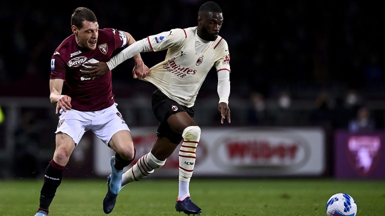 Andrea Belotti of Torino, left, and Pierre Kalulu of Milan battle for the ball during the Serie A soccer match between Torino FC and AC Milan. (Fabio Ferrari/LaPresse via AP)