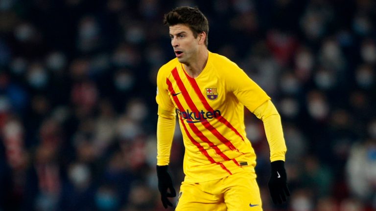 Barcelona's Gerard Pique runs for the ball during the Spanish La Liga soccer match between Granada and Barcelona at Los Carmenes stadium in Granada, Spain, Saturday, Jan. 8, 2022. (Fermin Rodriguez/AP)