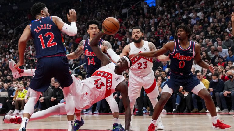 Toronto Raptors forward Pascal Siakam (43) tries to get a shot off as he falls past Philadelphia 76ers forward Tobias Harris (12) as 76ers forward Danny Green (14), Raptors guard Fred VanVleet (23) and 76ers guard Tyrese Maxey (0) look on during first half NBA first round playoff action in Toronto on Wednesday April 20, 2022. (Nathan Denette/CP)