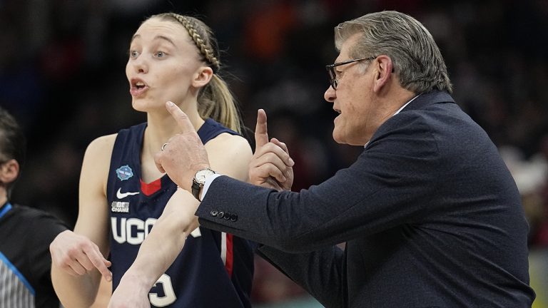 UConn head coach Geno Auriemma talks to Paige Bueckers during the second half of a college basketball game in the semifinal round of the Women's Final Four NCAA tournament. (Eric Gay/AP)