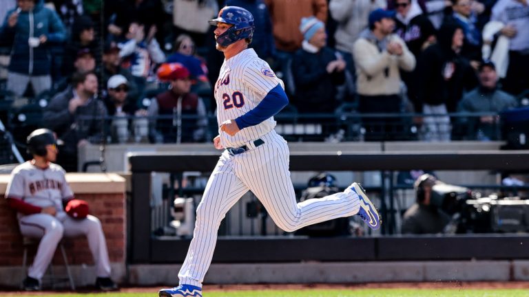 New York Mets designated hitter Pete Alonso (20) scores off of an RBI double from New York Mets' Eduardo Escobar against the Arizona Diamondbacks during the bottom of the sixth inning of a baseball game. (Jessie Alcheh/AP)