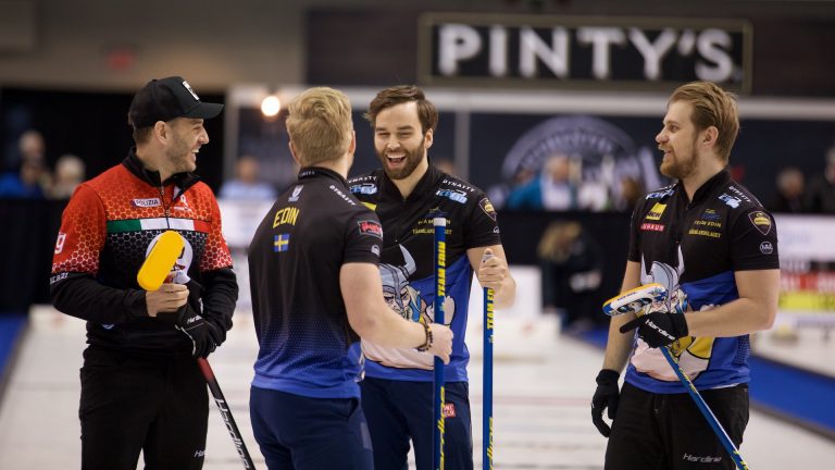From left to right, Joël Retornaz shares a laugh after the game with Niklas Edin, Oskar Eriksson and Rasmus Wranå following the third draw of the Princess Auto Players' Championship on April 12, 2022 in Toronto. (Anil Mungal)