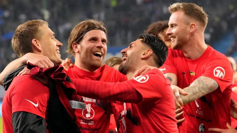 Freiburg players celebrate their win against Hamburg after the end of the German Cup, semifinal soccer match between Hamburger SV and SC Freiburg in Hamburg, Germany, Tuesday, April 19, 2022. Freiburg beet the Hamburg 3-1. (Martin Meissner/AP)