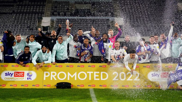 Fulham celebrate promotion to the Premier League after the League Championship soccer match against Preston at Craven Cottage. (Adam Davy/AP)
