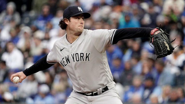 New York Yankees starting pitcher Gerrit Cole throws during the first inning of a baseball game against the Kansas City Royals. (Charlie Riedel/AP)