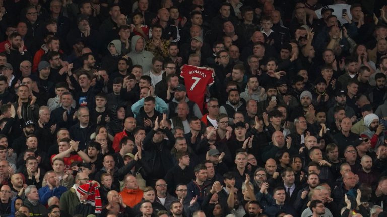 Liverpool fans applaud on the seventh minute in support for Manchester United's Cristiano Ronaldo and his family during the English Premier League soccer match between Liverpool and Manchester United at Anfield stadium in Liverpool, England, Tuesday, April 19, 2022. (Jon Super/AP)