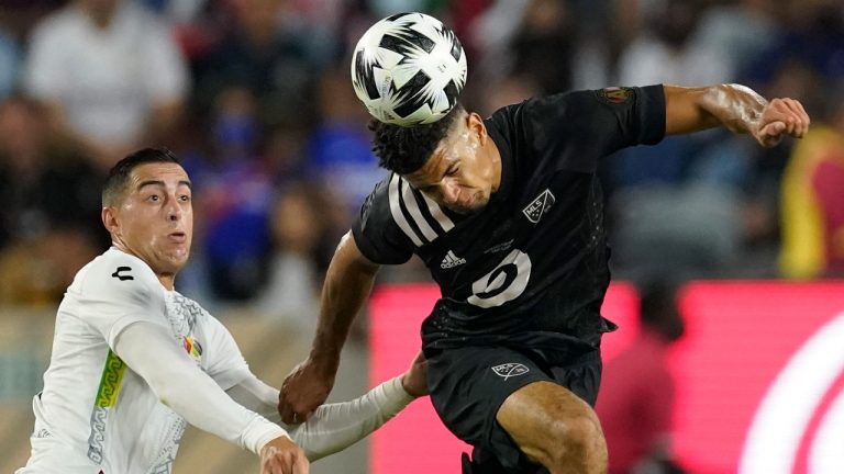 Atlanta United defender Miles Robinson, right, heads the ball against Liga MX All-Stars defender Victor Guzman during the second half of the the MLS All-Star soccer match Wednesday, Aug. 25, 2021, in Los Angeles. (Ashley Landis/AP)