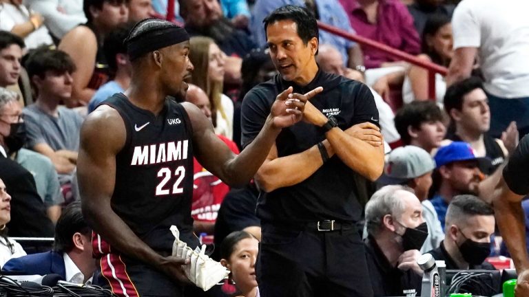Miami Heat forward Jimmy Butler (22) talks to head coach Erik Spoelstra during the second half of an NBA basketball game against the Philadelphia 76ers, Saturday, March 5, 2022, in Miami. (Marta Lavandier/AP)