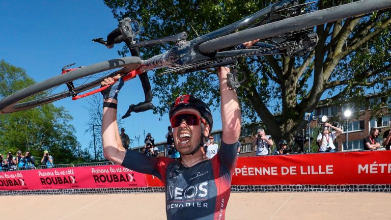 Dylan Van Baarle celebrates after winning the Paris-Roubaix cycling race, a 257 kilometer (160 mile) one-day-race at the velodrome in Roubaix, northern France, Sunday, April 17, 2022. (Thomas Samson, Pool via AP)