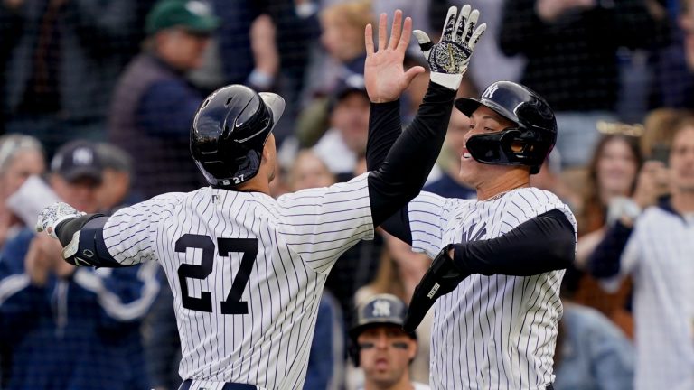 New York Yankees' Giancarlo Stanton celebrates with Aaron Judge, right, after hitting a two-run home run off Boston Red Sox starting pitcher Nick Pivetta in the sixth inning of a baseball game. (John Minchillo/AP)