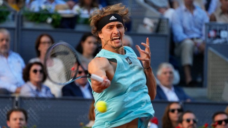Alexander Zverev, of Germany, returns the ball to Carlos Alcaraz, of Spain, during the final match at the Mutua Madrid Open tennis tournament in Madrid, Spain, Sunday, May 8, 2022. (Paul White/AP)