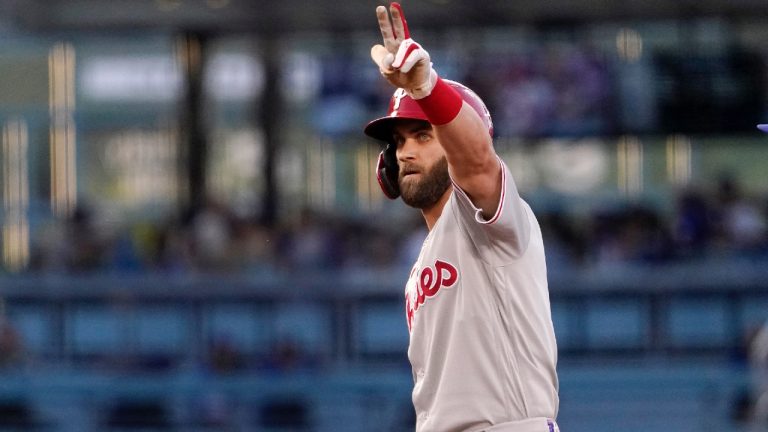 Philadelphia Phillies' Bryce Harper gestures toward his dugout after hitting a double during the first inning of a baseball game against the Los Angeles Dodgers Saturday, May 14, 2022, in Los Angeles. (Mark J. Terrill/AP)
