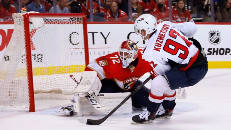 Washington Capitals center Evgeny Kuznetsov (92) scores against Florida Panthers goaltender Sergei Bobrovsky (72) during the third period of Game 1 of an NHL hockey first-round playoff series Tuesday, May 3, 2022, in Sunrise, Fla. (Reinhold Matay/AP)